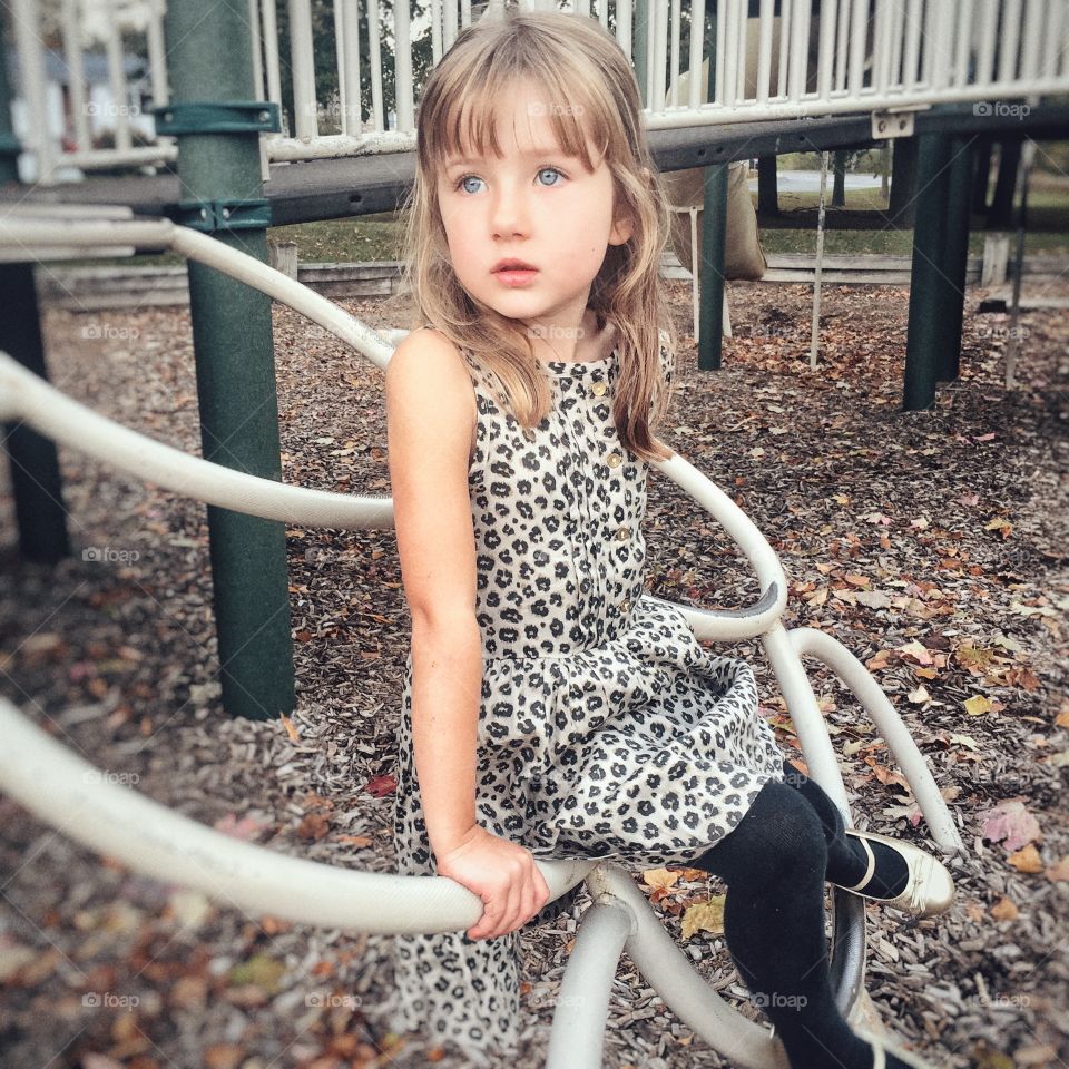 Girl sitting on pool