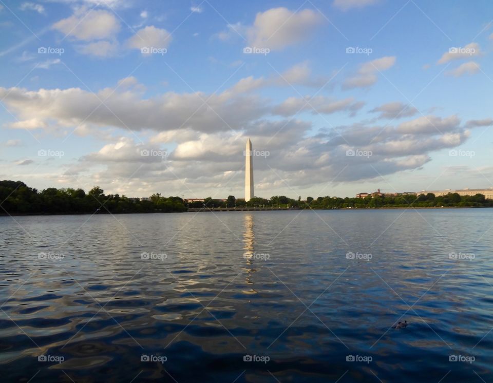 Washington Monument, water, and clouds