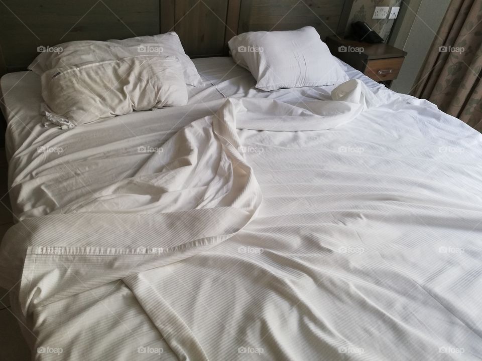 Unmade bed in the morning