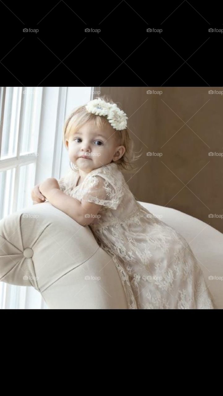 Little Girl Modeling on Couch