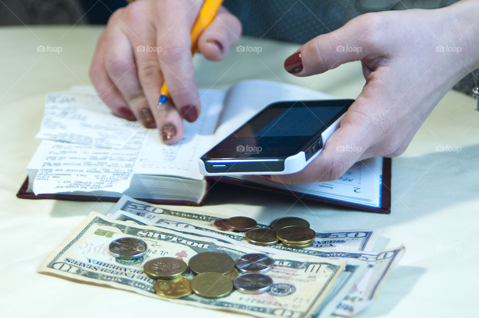 woman takes notes in notepad and says Finance