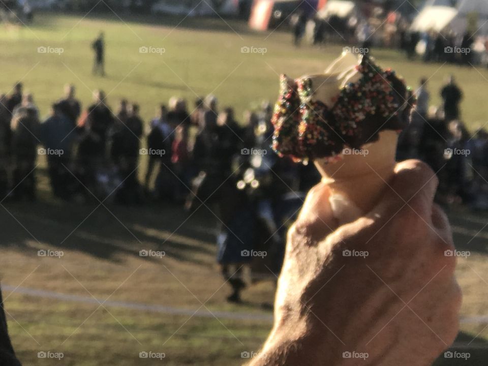 The best photo of the day is sometimes the one u didn’t mean to take....Man with ice cream in hand cheering the jousting knights at Winterfest 
