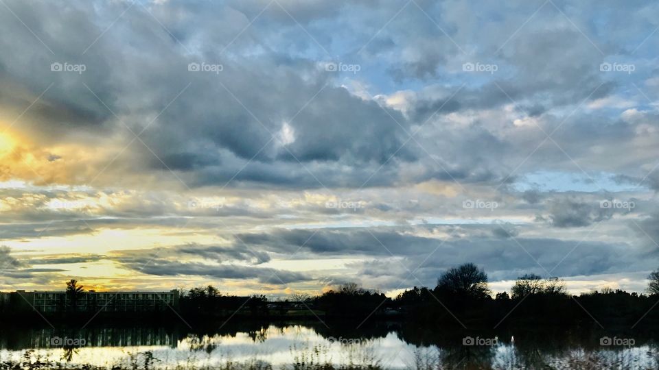 Water colors sky reflection over pond