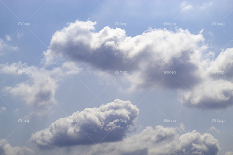 The beauty of the sky with clouds and the sun.