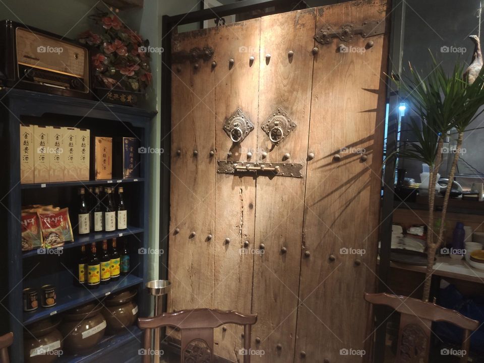 Ancient wooden door in  restaurant Kuala Lumpur 