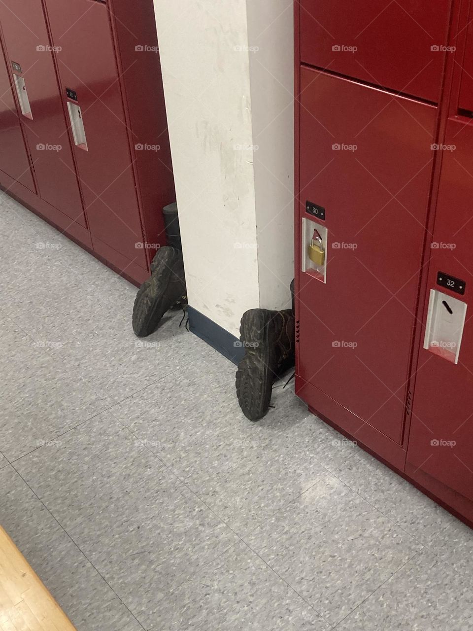 Drying boots in a locker room creates a comical optical illusion 