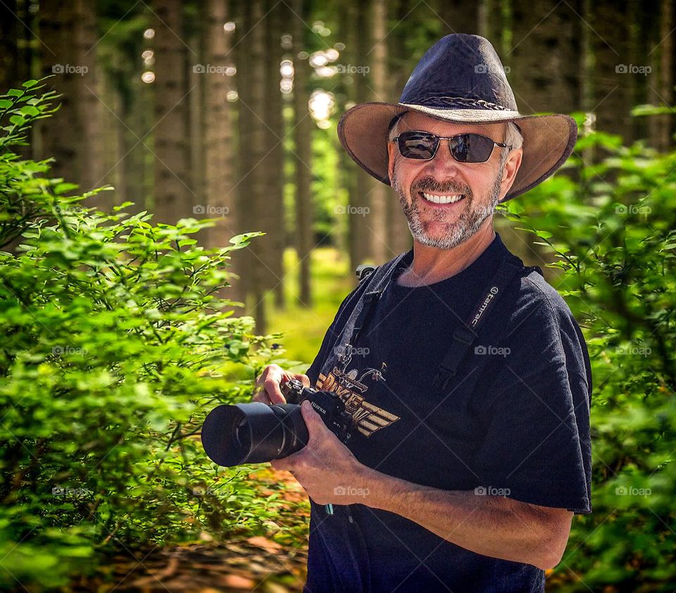 Portrait of a photographer in the field.