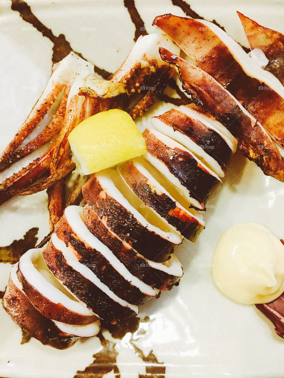 Grilled squid with lemon slice japanese cuisine seafood