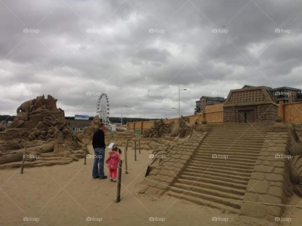 tourist looking at 
sand sculptures, sand sculpture,  sand,  sandy,  sands