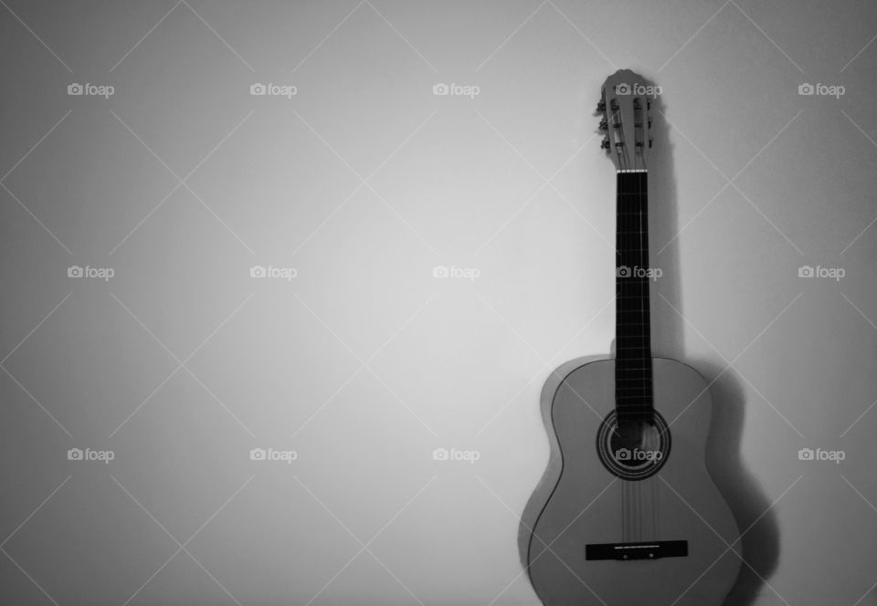 black and white guitar . minimalist photo of a black and white guitar
