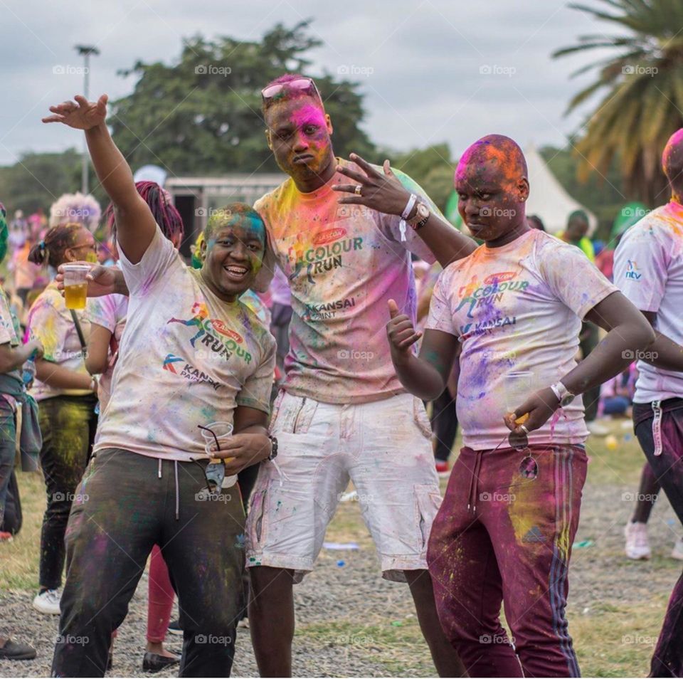 Friends having fun at a colour run...