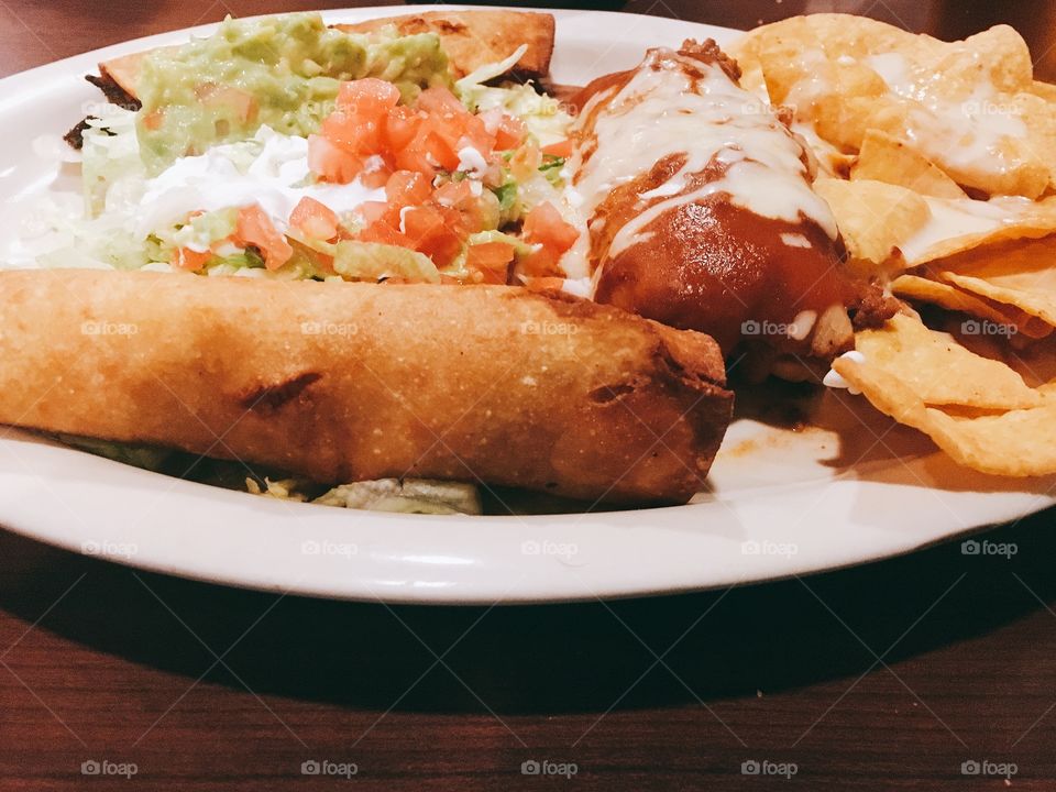Mexican food including delicious taqueria, enchiladas and nachos 