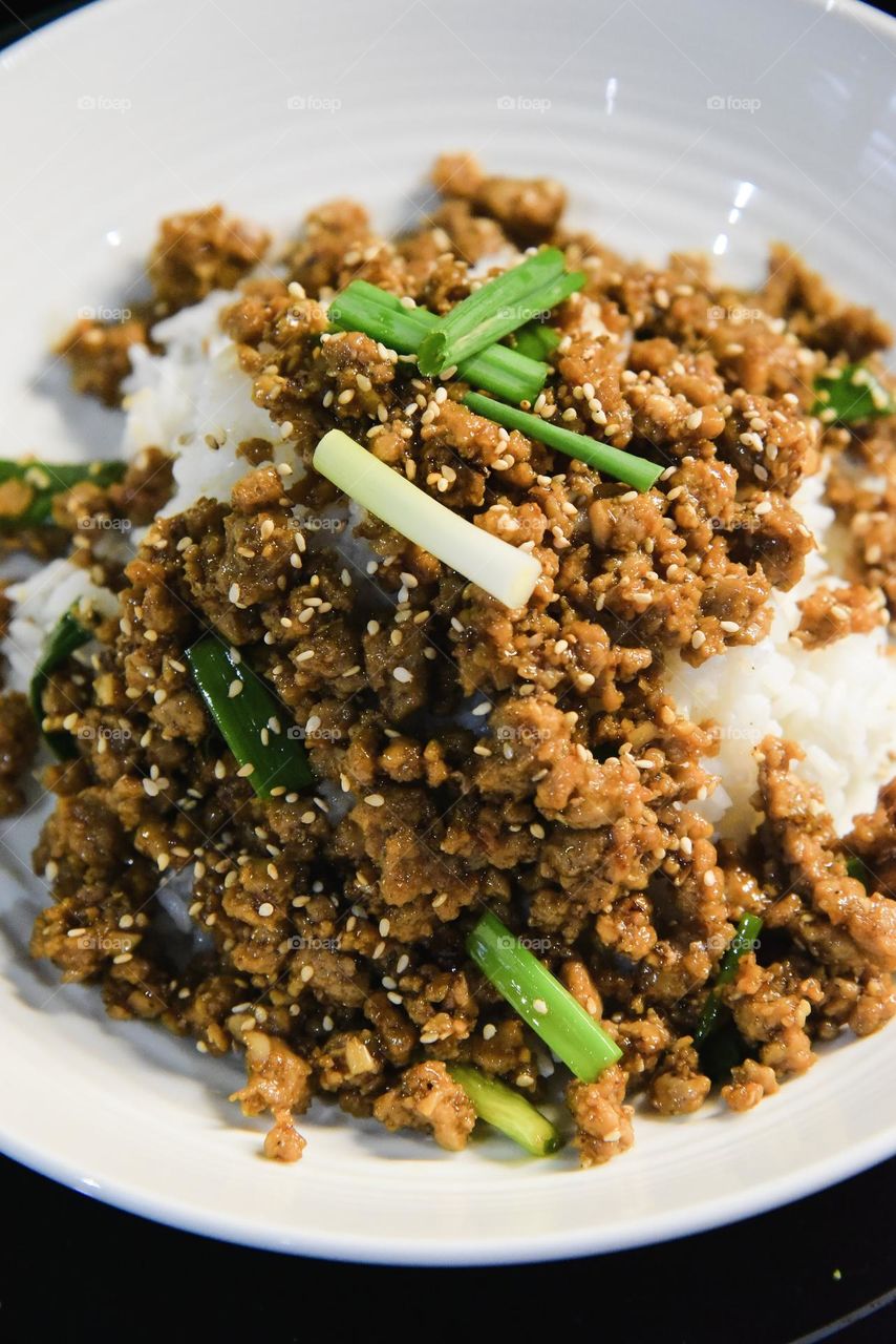 ground chicken on a bed of rice.