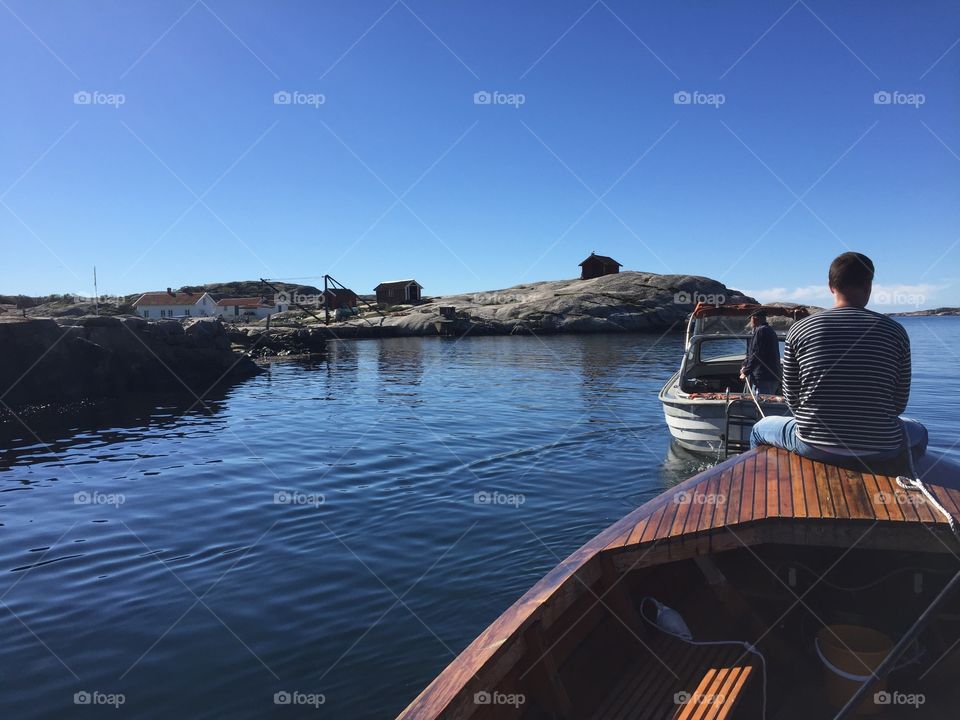 Man sitting on boat at sea