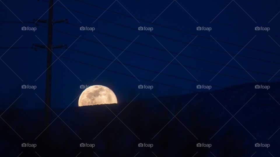 Moon rising over the mountains 