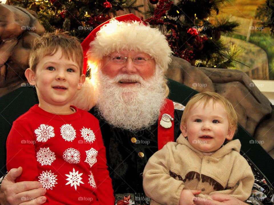 Kids Sitting On Santa's Lap