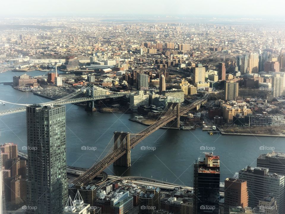 Brooklyn Bridge and part of New York’s cityscape, viewed from One World Observatory, in a winter afternoon.
