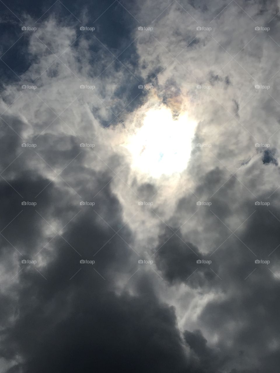 Sun behind a cloud