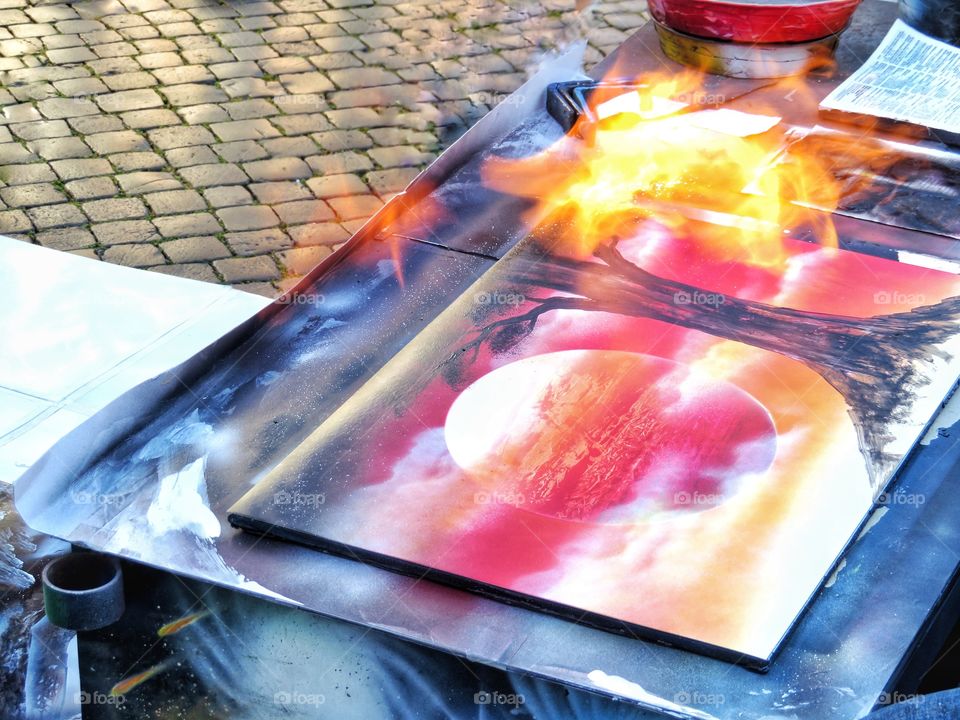 street art spray painting with flame moment