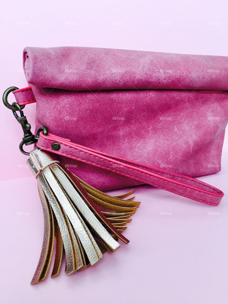 Studio shot of pink suede bag