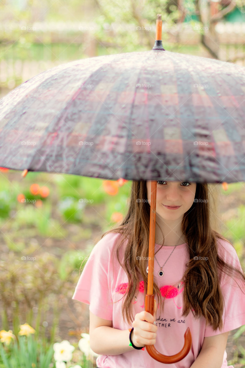 Portrait of teenage girl with umbrella.
