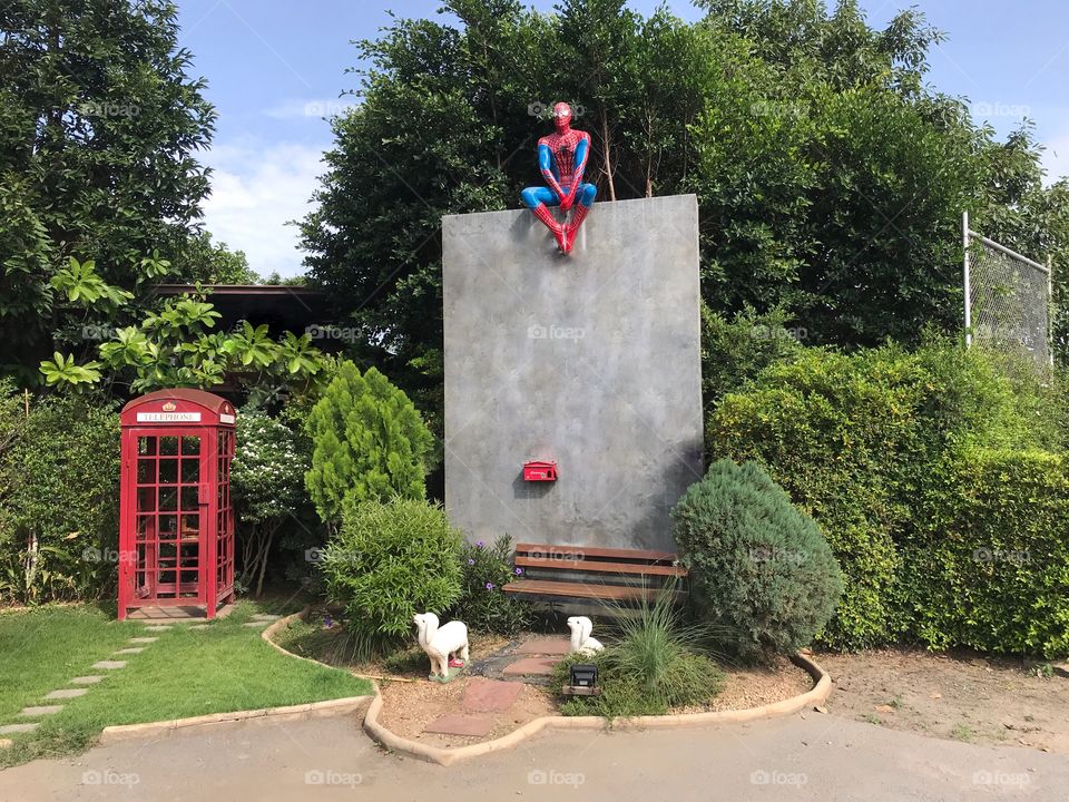 Spiderman sitting on wall