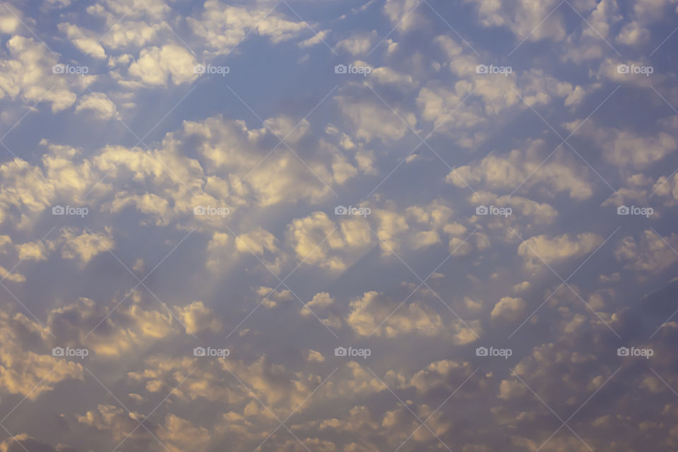 Sky and clouds reflected the morning sun.