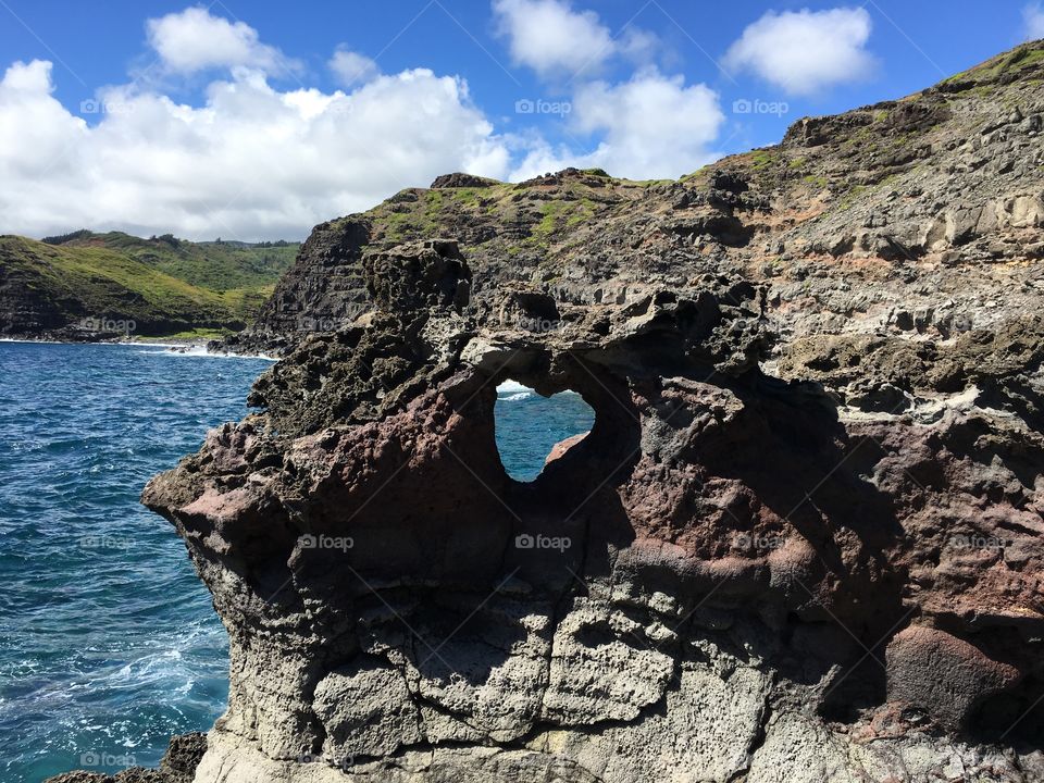 A heart shaped rock formation on the stunning cliffs near the Blow Hole in Maui, Hawaii. 