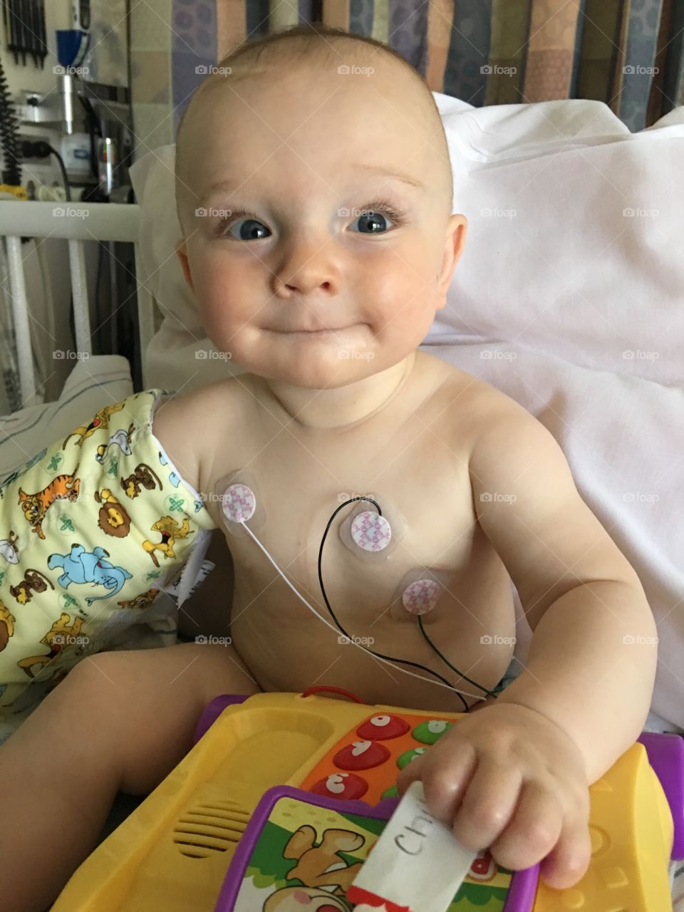 Cute baby with ecg on his chest