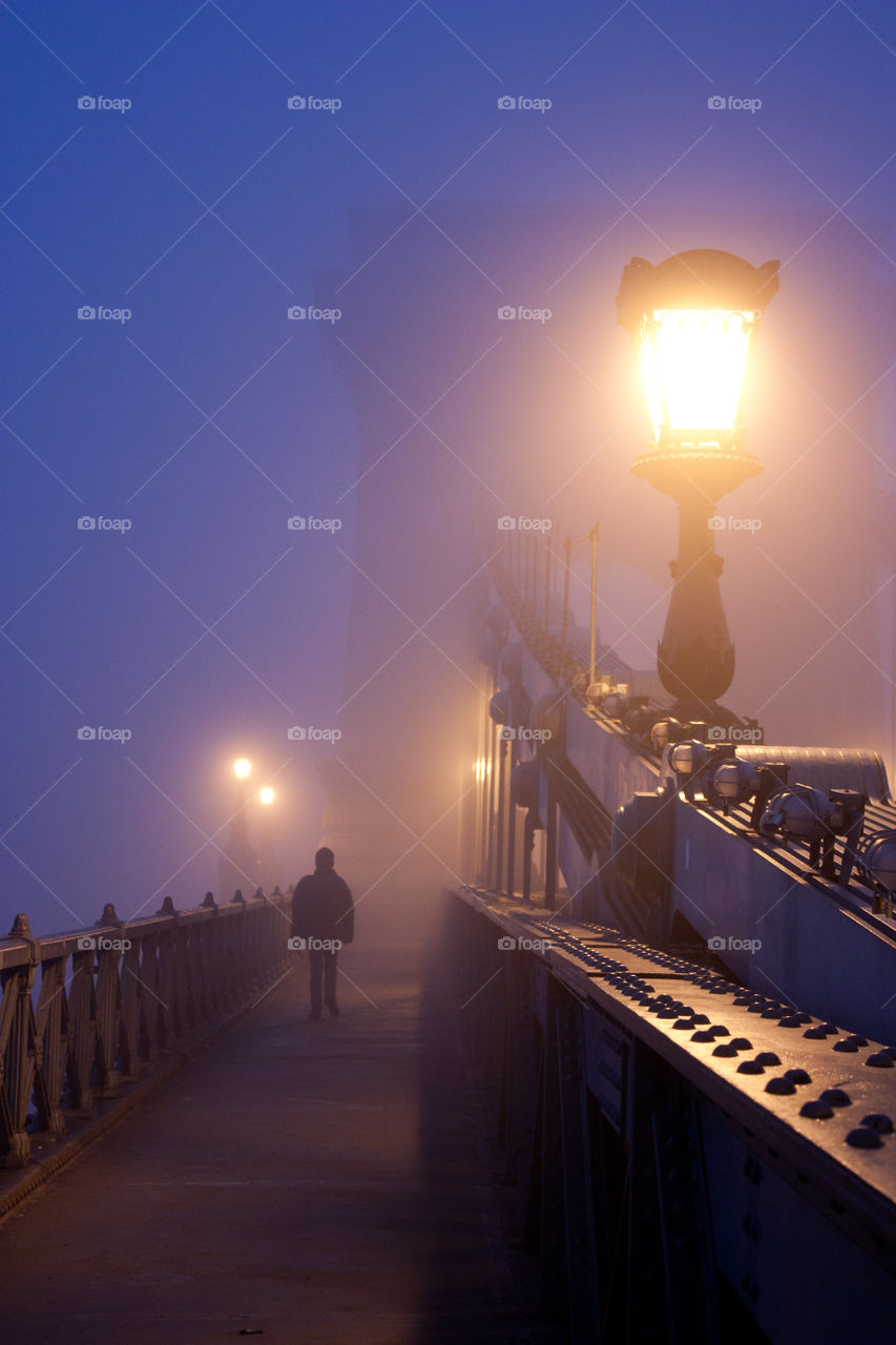 A man walking into the fog