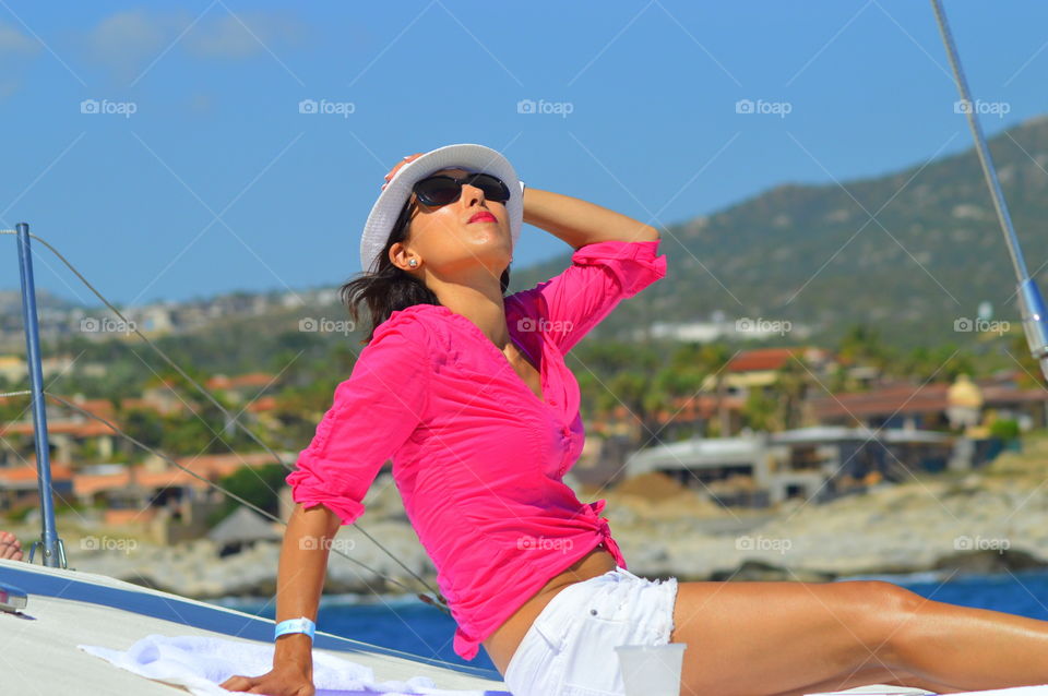 Sailing through life with the necessities - the beach, sun, and a beverage