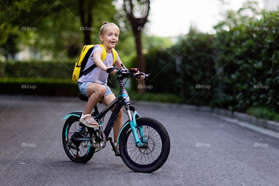 Kid riding on bicycle 