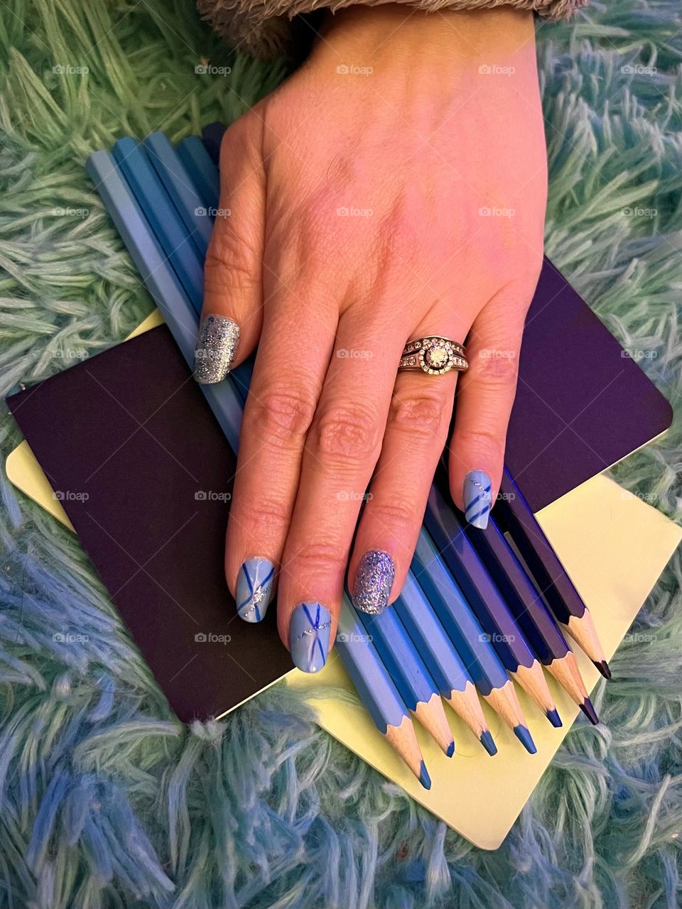 Pretty bright blue gel nail polish manicure to show off my wedding rings 