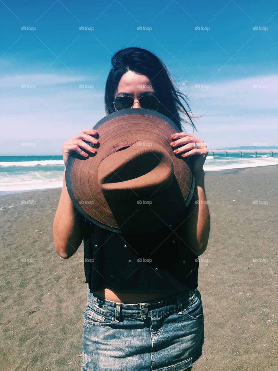 Female with hat at beach