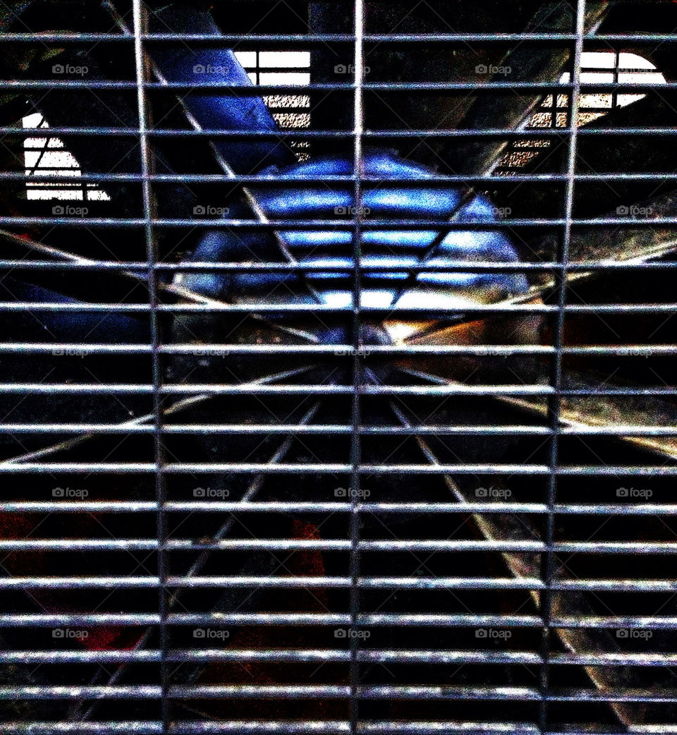 Steel grille and blades of an industrial fan