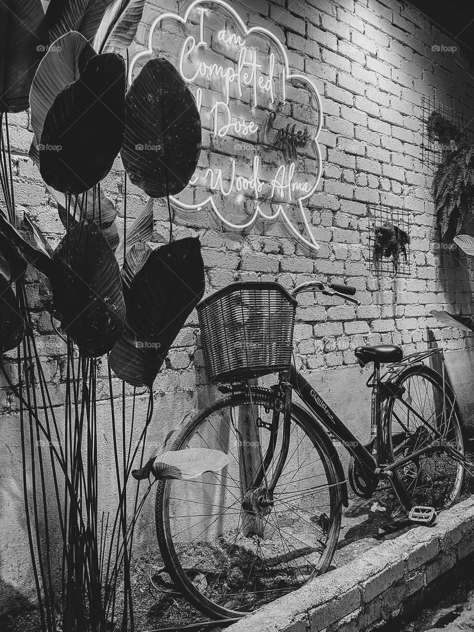 Rusty bicycle being left lonely as decoration in a cafe.