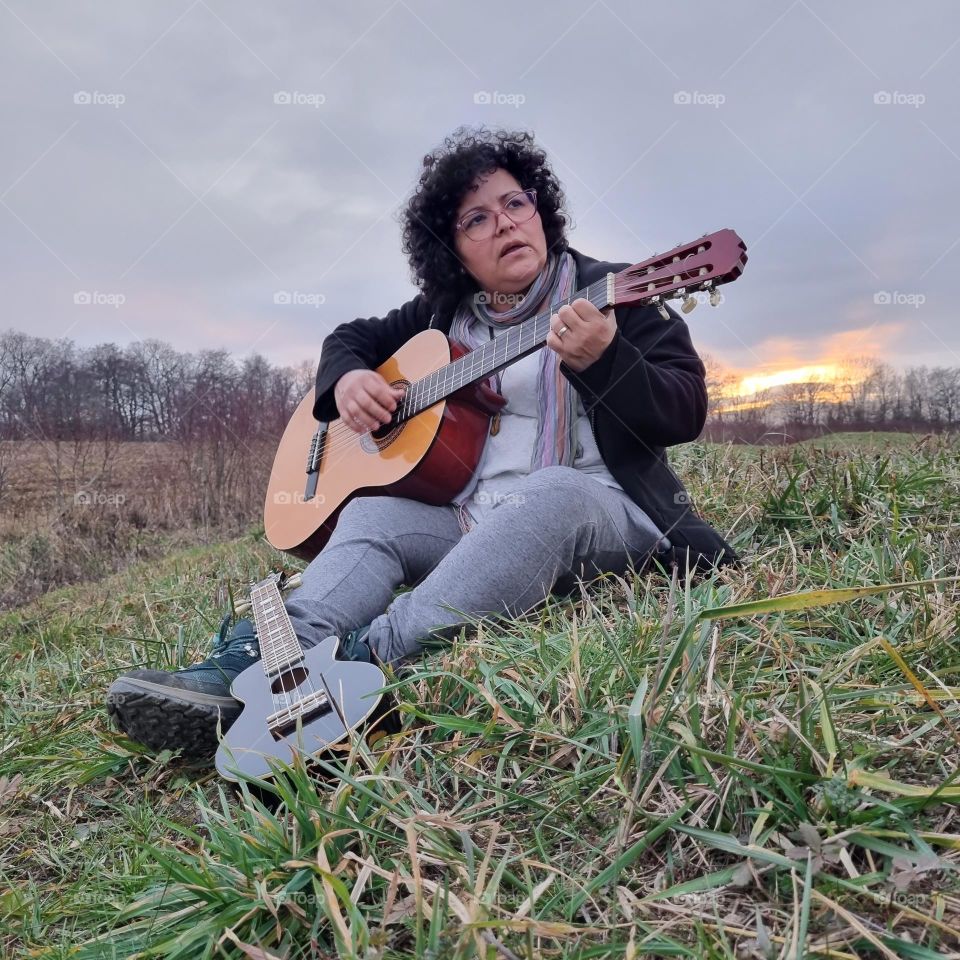 Sunset, woman, guitar and ukulele