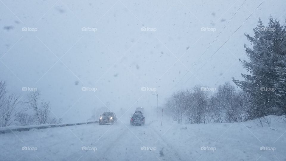 Driving in the snow blizzard