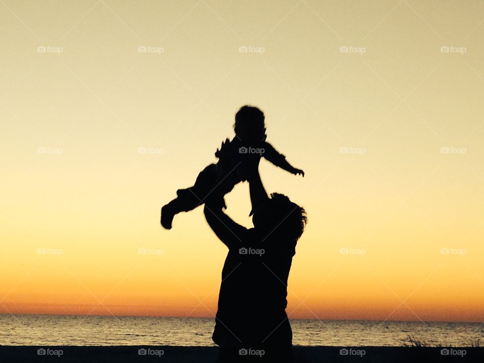 Silhouette of mom and baby