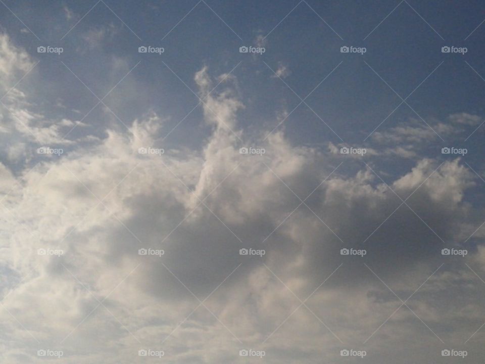 A man canoeing in the sky.