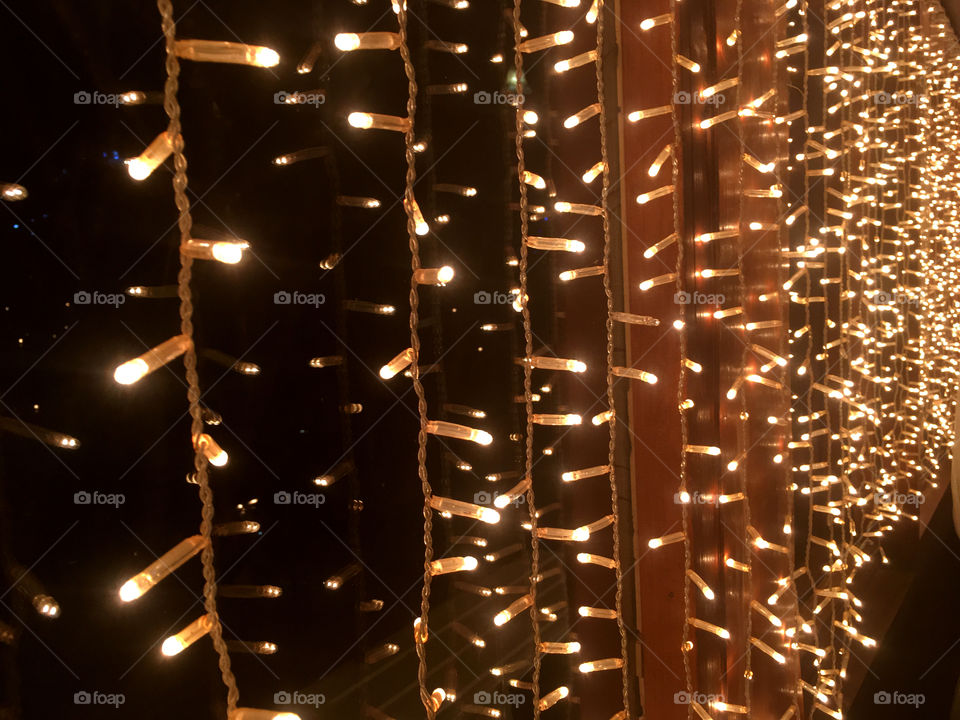 String lights in window at night