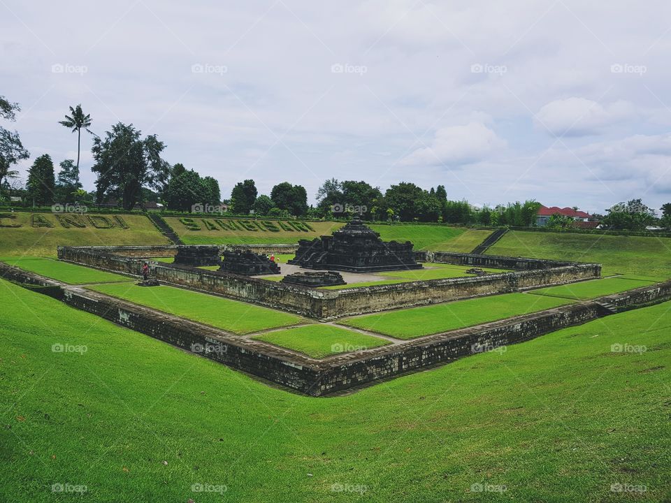 This is a Sambisari Temple. Located in Special Region of Yogyakarta, Indonesia. This temple looks unique because of its location that is below the soil surface. In terms of architecture, Sambisari temple is classified into the building from the 8th century. While based on the stones used in Sambisari temple, the rock is Padas, then its founding period during the temple of Prambanan, Plaosan, and Sojiwan around the 9th century up to the century 10th.