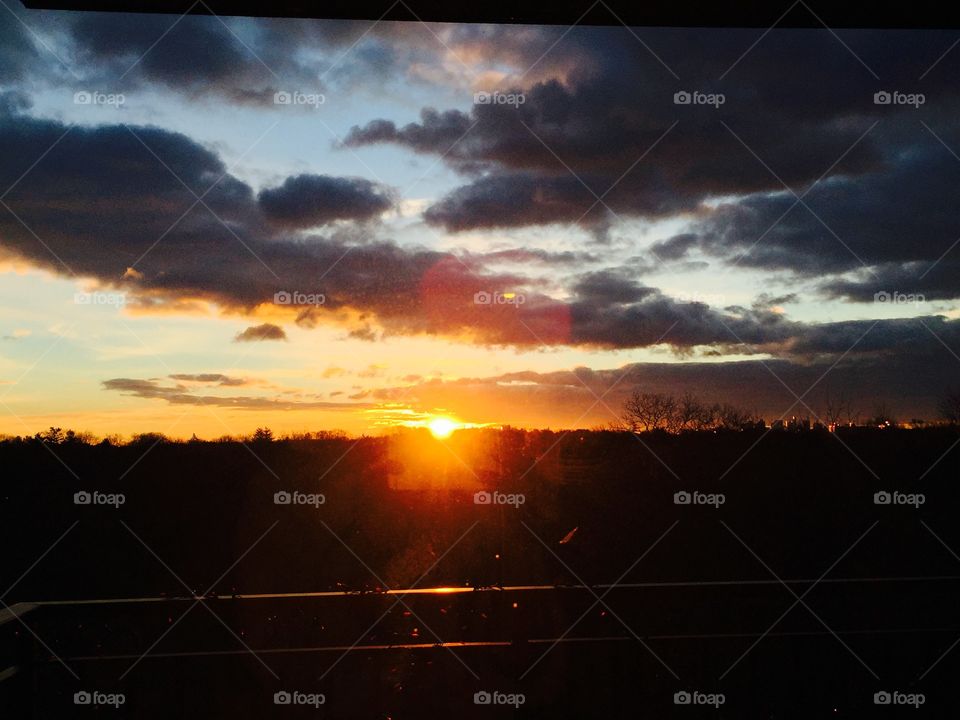 Sub raise over city view tree line beautiful orange red colors 