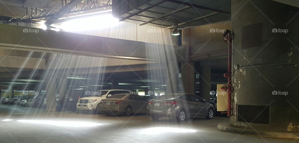 picture taken at king Khalid garage airport. while the grage is dark the sunrays enter it and gives a live to the grage