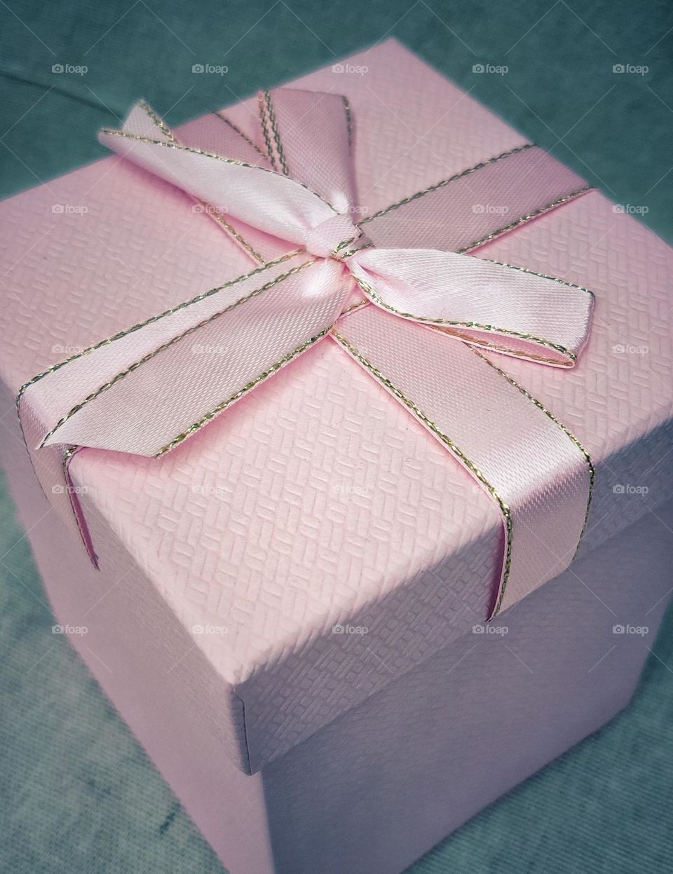a pink box with a bow