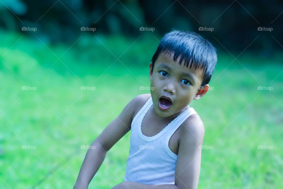 Portrait of boy in park.