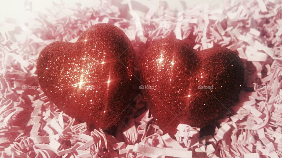Red hearts against abstract background