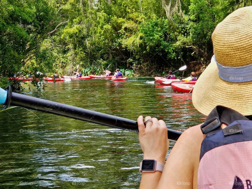 We pause a moment while tiny kayakers paddle safely around us