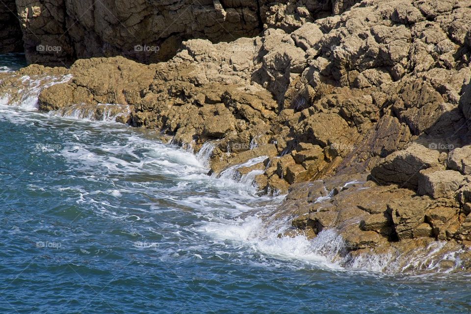 waves crashing on rocks