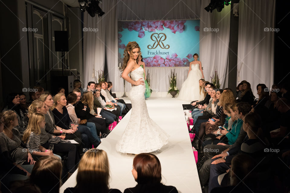 Fashion show at a wedding fair. Here are the latest dresses and clothes for both bride and groom